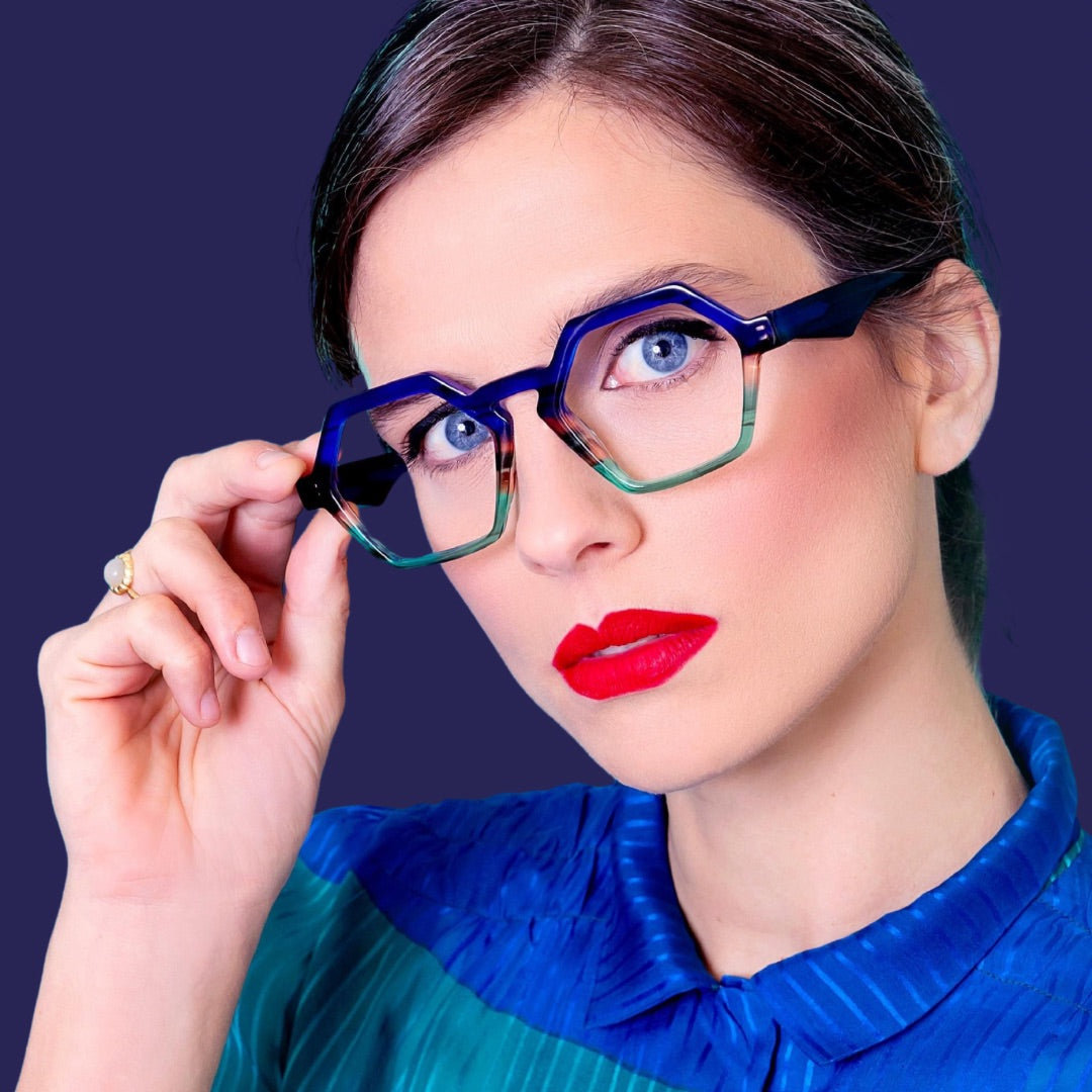 Lady in Colourful glasses which enhance her blue eyes